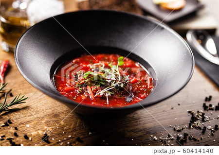 Beetroot soup served in a bowl in restaurant 60414140