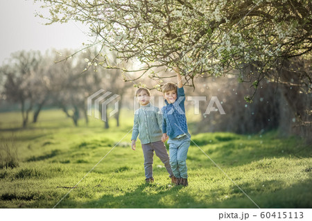 Two friends in the summer in the Park have fun and frolic outdoors 60415113