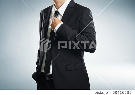 Confidence businessman in black suit , close up . Confidence businessman in black suit , close up . 60416589
