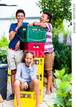 Happy kids near the bottles crate 60416614