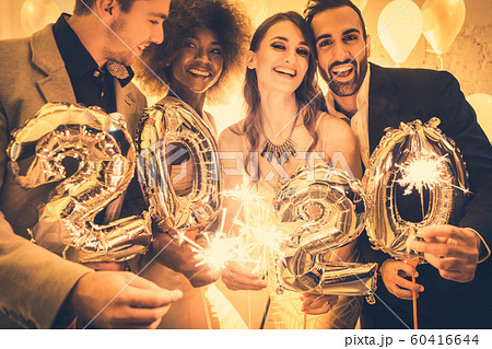 Men and women celebrating the new year 2020 Men and women celebrating the new year 2020 60416644