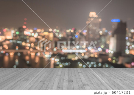 Wood floor terrace or wooden table with blur background rooftop perspective view city night light bokeh 60417231