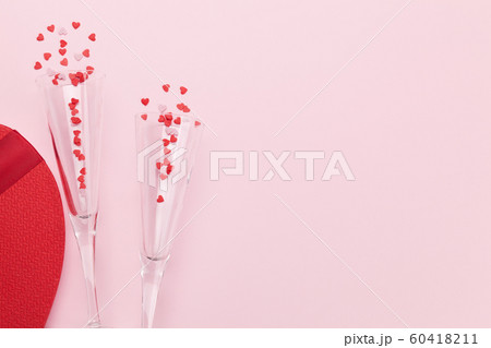 Champagne glasses and heart shaped sweets holiday Champagne glasses and heart shaped sweets holiday 60418211