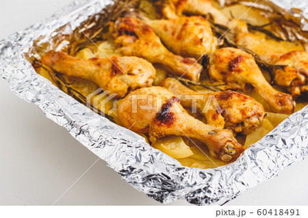 Chicken Legs Baked with Potatoes Chicken Legs Baked with Potatoes 60418491