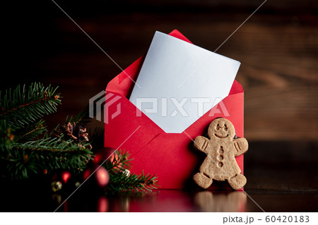 Gingerbread man and Christmas tree with red envelope Gingerbread man and Christmas tree with red envelope 60420183