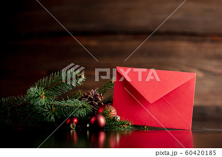 Red envelope and Christmas tree decoration on wooden table Red envelope and Christmas tree decoration on wooden table 60420185
