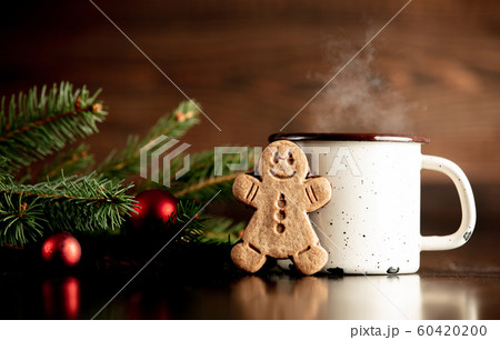Cup of coffee and gingerbread man cookie Cup of coffee and gingerbread man cookie 60420200