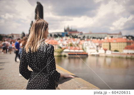 woman on Charles bridge in Prague, Czech Perublic 60420631