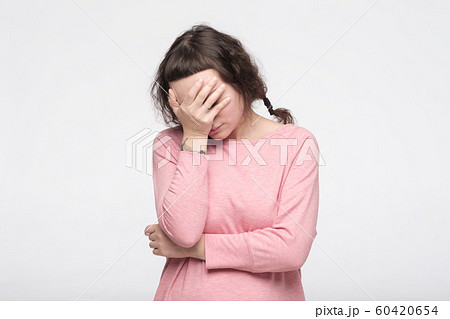 Caucasian pretty woman making facepalm being depressed with exam results. Caucasian pretty woman making facepalm being depressed with exam results. 60420654