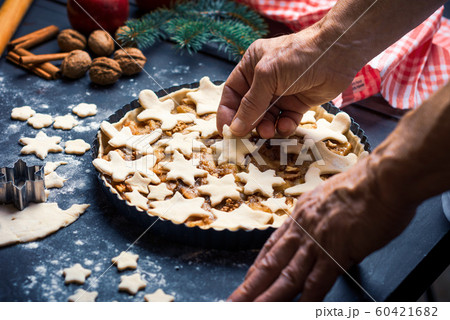 Senior making a festive decorated apple pie at Senior making a festive decorated apple pie at 60421682