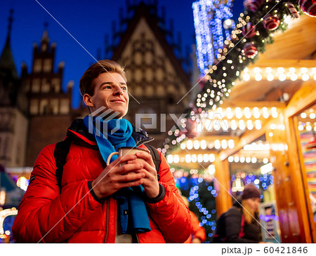 Young boy with drink on Christmas market 60421846