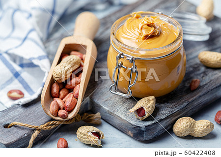 Jar with creamy peanut butter. 60422408