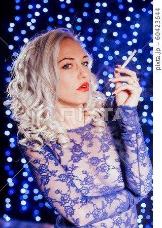 sexy blonde in blue lingerie red lips smokes 60423644