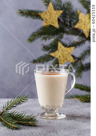Christmas background with, gift boxes, stars, festive decor, fir tree, cinnamon sticks, hot eggnog 60425559