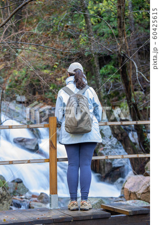 Spanish tourist woman looking a small river in the Spanish tourist woman looking a small river in the 60425615