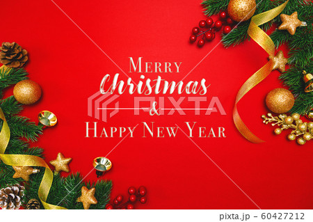 Christmas pine tree with xmas decoration on Red background Christmas pine tree with xmas decoration on Red background 60427212