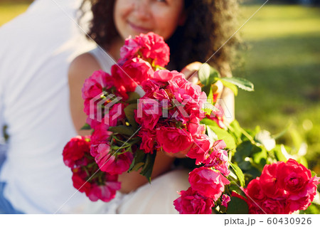Beautiful adult couple spend time in a summer field 60430926