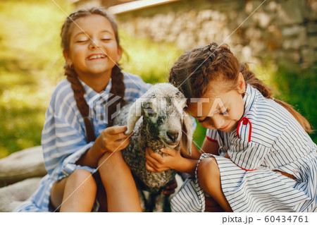 beautiful girl with goat 60434761