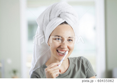 Young woman brushing teeth. Young woman brushing teeth. 60435062