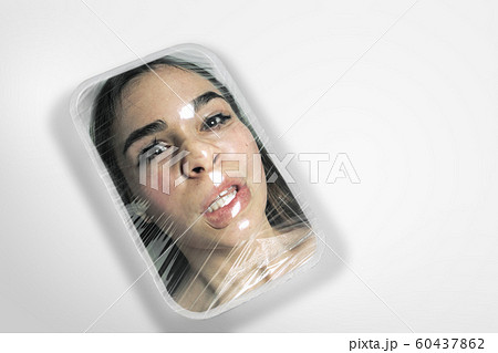 Human head as a goods in plastic box isolated on white background, ecology concept 60437862