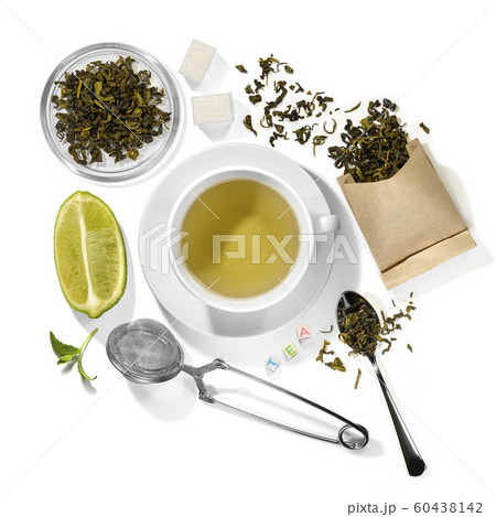 Green tea and accessories top view on white background 60438142