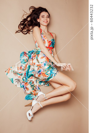 girl in colored dress rests with the floor smile girl in colored dress rests with the floor smile 60443232