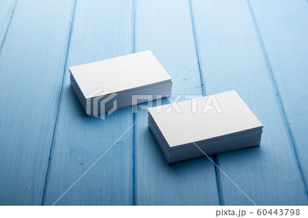 Business card blank on wooden background. Corporate Stationery, Branding Mock-up. Creative designer desk. Flat lay. Copy space for text 60443798
