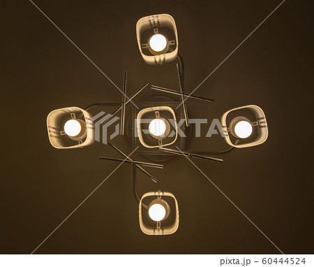 led light bulb in the industrial lamp is bright on 60444524