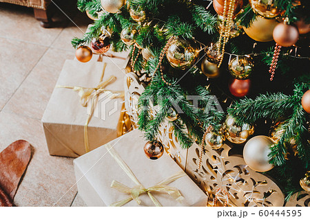 Decorated Christmas tree in gold and yellow Decorated Christmas tree in gold and yellow 60444595