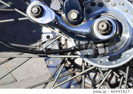 Fragment of chromed shiny wheel of old classic 60445827