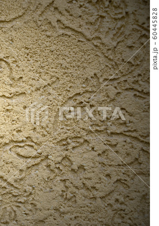 The texture of the beige decorative plaster in The texture of the beige decorative plaster in 60445828