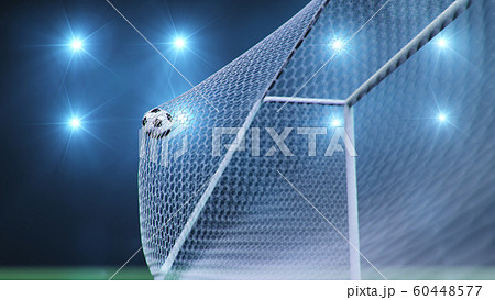 Soccer ball flew into the goal. Soccer ball bends the net, against the background of flashes of light. Soccer ball in goal net on blue background. A moment of delight. 3D illustration 60448577