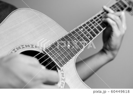 Musicians are playing acoustic guitar. Musicians are playing acoustic guitar. 60449618
