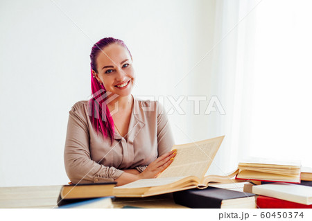 business girl sits in the Office for books folders of paper business girl sits in the Office for books folders of paper 60450374