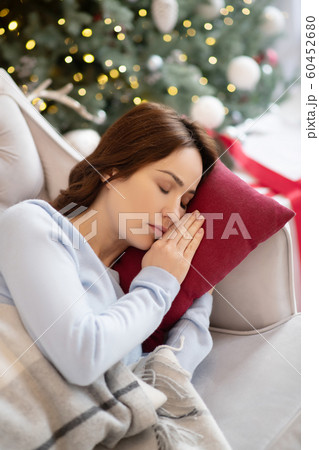 Picture of young cute woman sleeping on the sofa 60452680