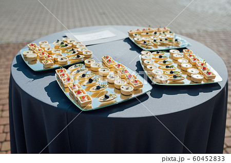 Snacks, fish and meat specialities on the buffet. 60452833