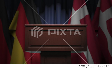 Many flags of Denmark and Germany behind speaker tribune, 3D rendering 60455213