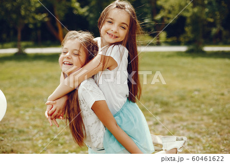 cute girls in a summer park cute girls in a summer park 60461622