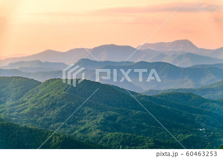 Layers of mountains in the haze during sunset. 60463253