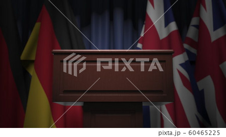 Many flags of Britain and Germany behind speaker tribune, 3D rendering Many flags of Britain and Germany behind speaker tribune, 3D rendering 60465225