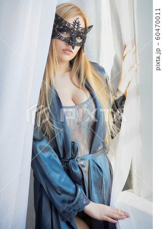 Young lovely lady in a mask 60470011