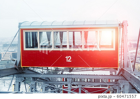 oldest ferris wheel in Vienna Prater amusement fair park. Bright sunset or sunrise sun through window 60471557