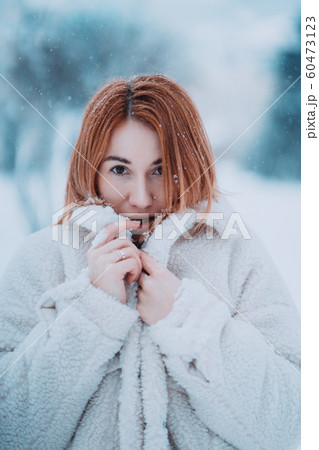 Portrait female model outside in first snow 60473123
