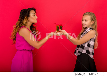 Cheerful mom and her cute daughter girl holding Cheerful mom and her cute daughter girl holding 60474090