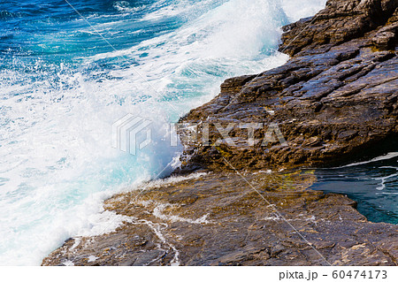 Background image of foam and waves on stone beach shore Background image of foam and waves on stone beach shore 60474173