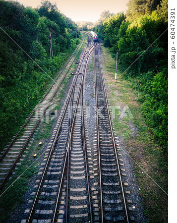 Railway rails with a leaving train. Railway rails. Railway rails with a leaving train. Railway rails. 60474391