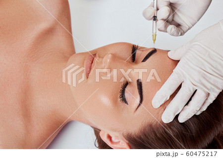 Closeup Of Beautiful Young Woman Getting Facial Closeup Of Beautiful Young Woman Getting Facial 60475217