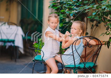 Pretty smiling little girls with shopping bags Pretty smiling little girls with shopping bags 60475874