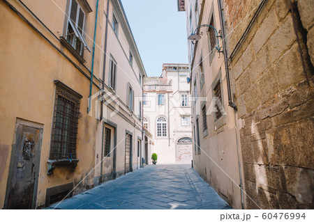 Old beautiful empty narrow streets in small city of Lucca in Italy 60476994