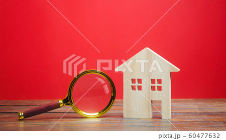 Wooden house and magnifying glass. House searching concept. Home appraisal. Property valuation. Choice of location for the construction. Search for housing, apartments. Real estate. Red background Wooden house and magnifying glass. House searching concept. Home appraisal. Property valuation. Choice of location for the construction. Search for housing, apartments. Real estate. Red background 60477632